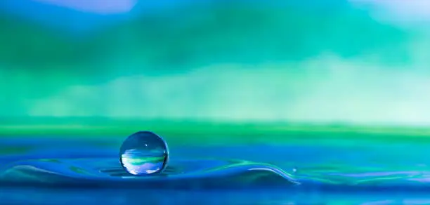 color photo of a water droplet splash front view