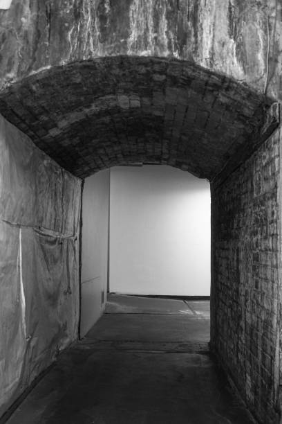 istock stone tunnel corridor in an old building 911360774