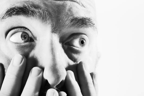 istock Worried man looks anxiously to the side 911366062