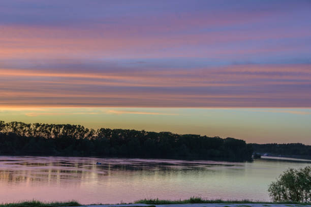 istock Scenery with river in the background light of the twilight sky 911368480