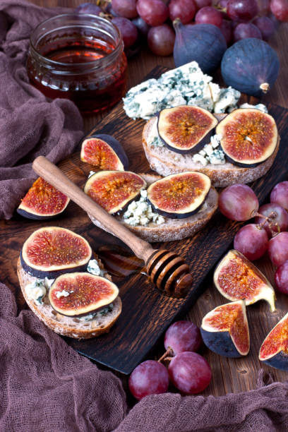 istock Still life with  figs and jam  or honey on bread slice 911375354
