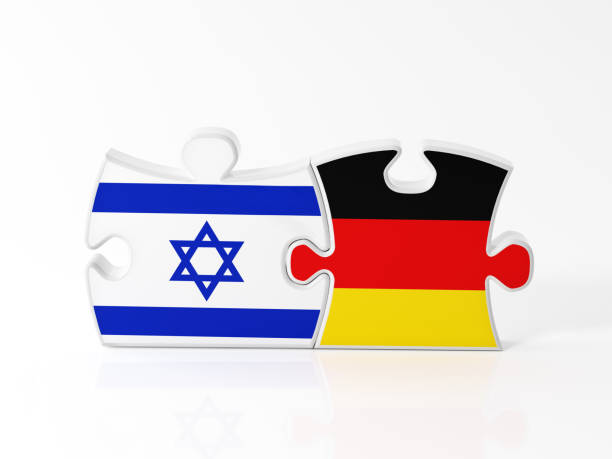 istock Jigsaw Puzzle Pieces Textured With Israeli And German Flags 911380542