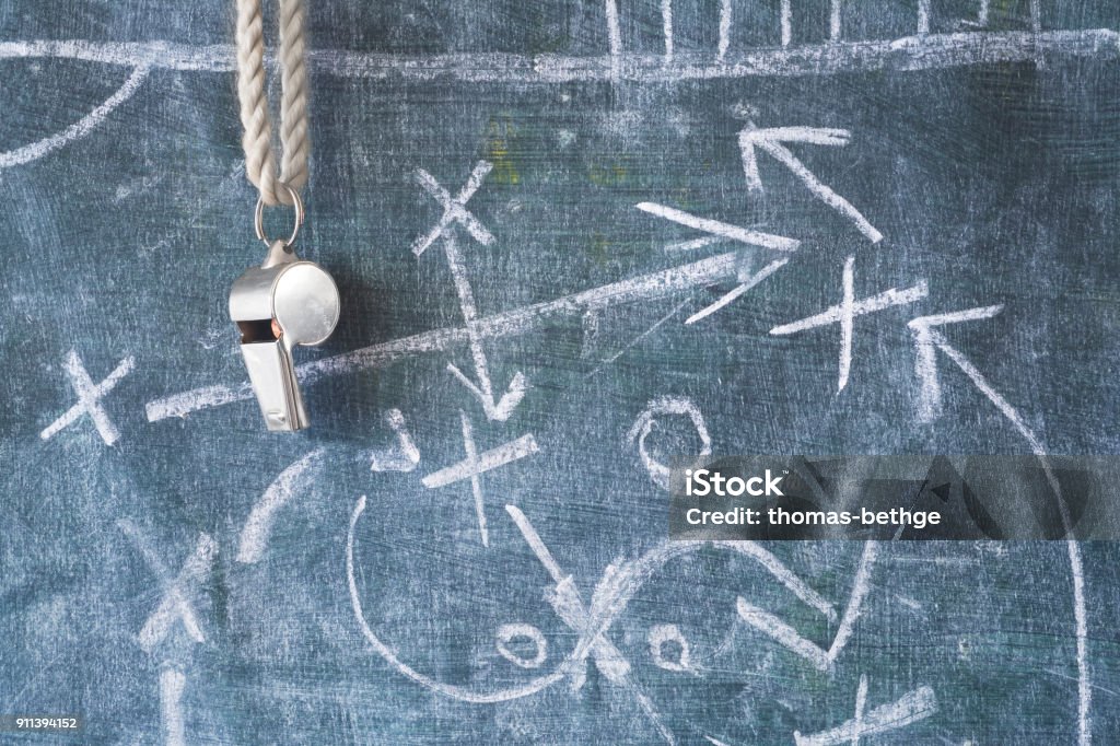 whistle of a soccer or football referee / coach on black board with tactical diagram Strategy Stock Photo