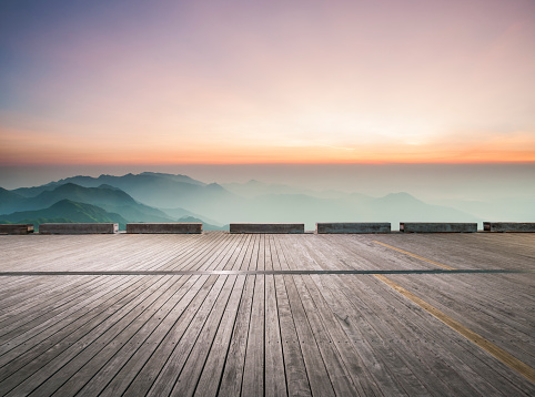 empty wooden board front of mountain ranges,China,Asia.