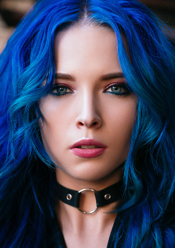 Closeup portrait of a blue-haired beautiful young girl (informal model)