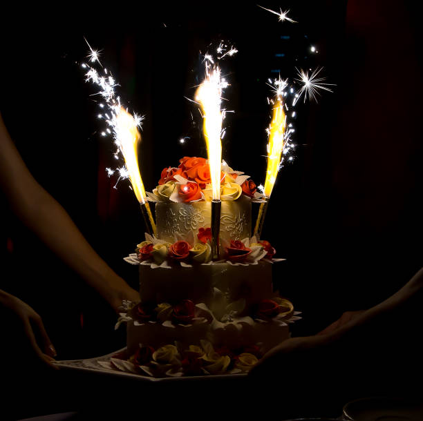 istock Celebration cake with candles and cake sparklers 911408502
