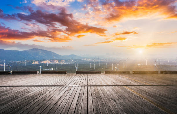 empty wooden board front of wind farm against sunset sky,Fujian province,China.