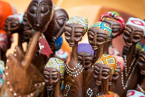 African tribal art for sale at a market stall. This artwork is generic and widely available across markets in South Africa.