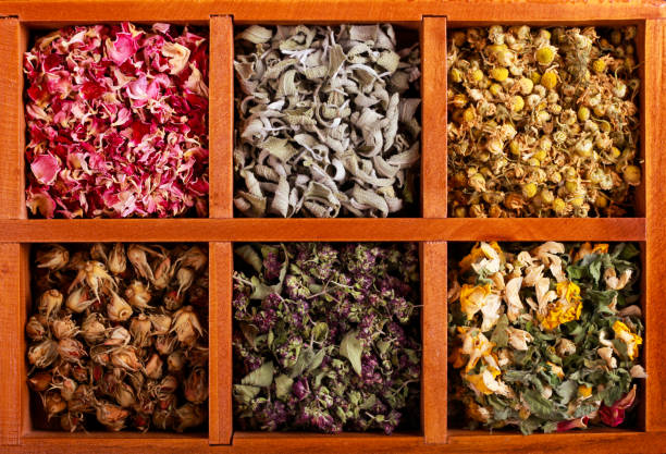 istock Dried herbs and flowers in wooden box, 911416152