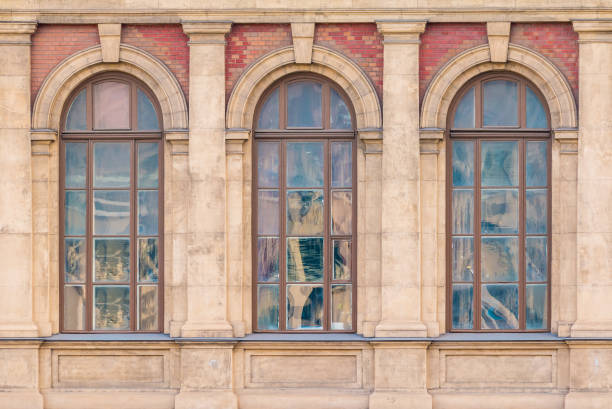 istock Windows in row on facade of historic building 911416174