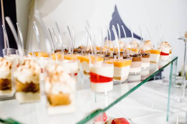 istock Wedding reception dessert table with delicious decorated white c 911418456