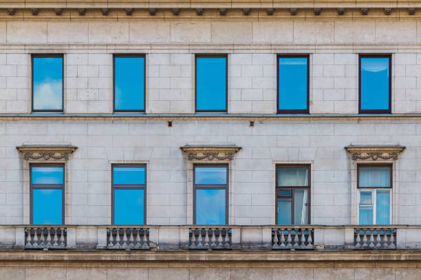 istock Windows in row on facade of historic building 911419216