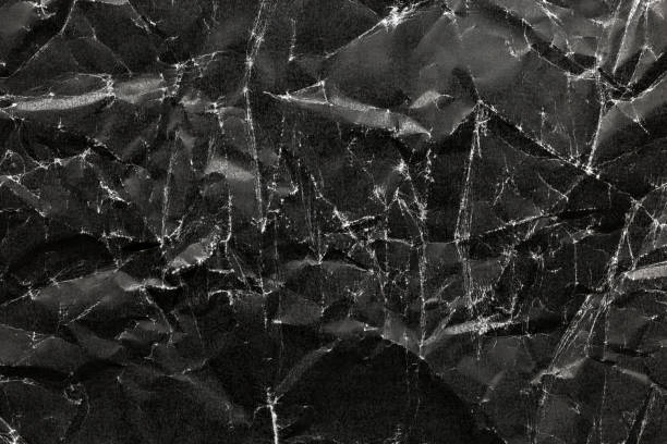 istock Black Crumpled Paper Background, black crumpled paper texture 911420630
