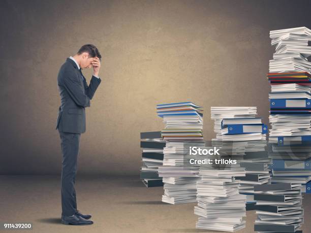 Businessman In Despair Stock Photo - Download Image Now - Paper, Ring Binder, Stack