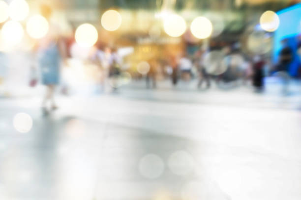 istock city people crowd abstract background blur action 911442020