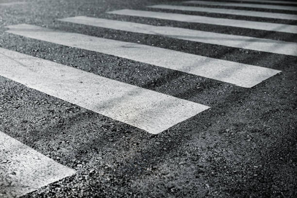istock pedestrian pathway on a street crossing 911442210