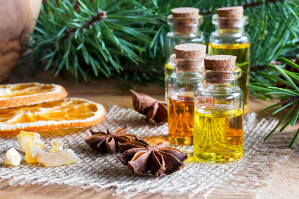 istock Selection of essential oils with Christmas spices and ingredients 911444956