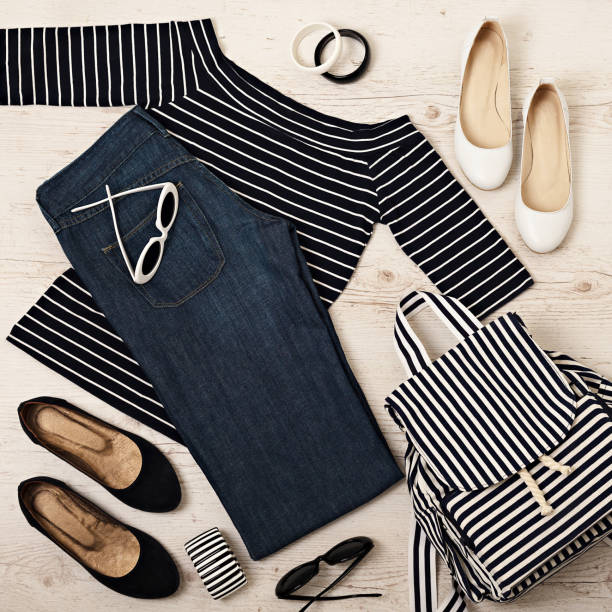 istock Female summer outfit - navy jeans, striped top, sunglasses, backpack. 911448088