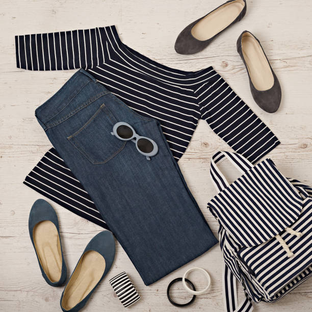 istock Female summer outfit - navy jeans, striped top, sunglasses, backpack. 911448092