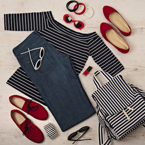 istock Female summer outfit - navy jeans, striped top, sunglasses, backpack. Selective focus. 911448106