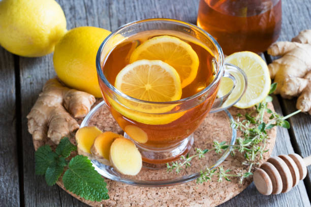 istock A cup of tea with ginger, lemon, honey and herbs 911448272