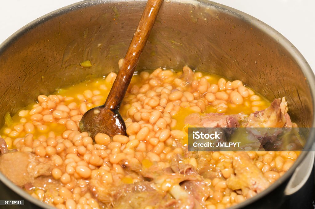 Cassoulet : Homemade Cassoulet is a French specialty of southern France, the best known city preparing cassoulet is Castelnaudary. In this picture, homemade Cassoulet. Cassoulet Stock Photo