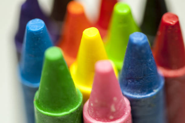 istock Close-up of colorful crayons tips 911459244