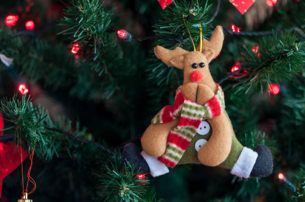 istock Reindeer decoration on a christmas tree. 911459296