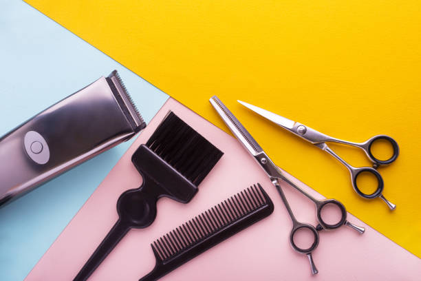 Professional hairdresser tools on colored background
