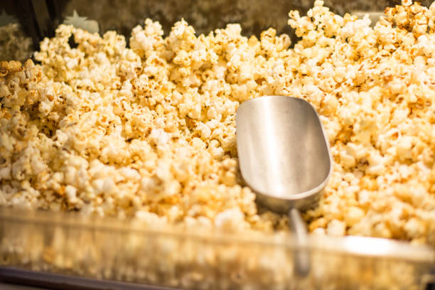 istock popcorn and ice Scoop in popcorn cabinet. 911463840