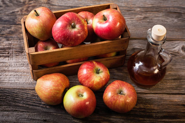 istock fresh apples in crates and apple vinegar 911474726
