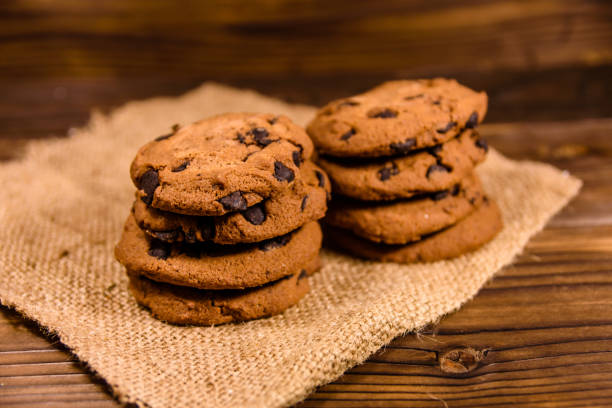 istock Chocolate chip cookies on sackcloth on a wooden table 911477668