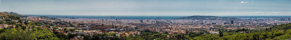 Panoramic sight of the city of Barcelona from Vallvidrera in Collserola's mountain, one summer morning.