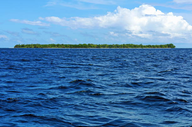 istock Tropical Island on the horizon 911491158
