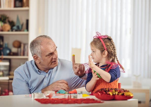 istock Father and Daughter crafting 911494278