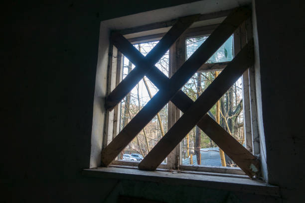 istock Interior of an abandoned building broken windows 911496878