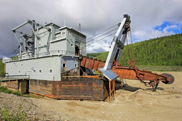 The remains of a historical delelict gold dredge on Bonanza creek near Dawson City, Yukon, Canada