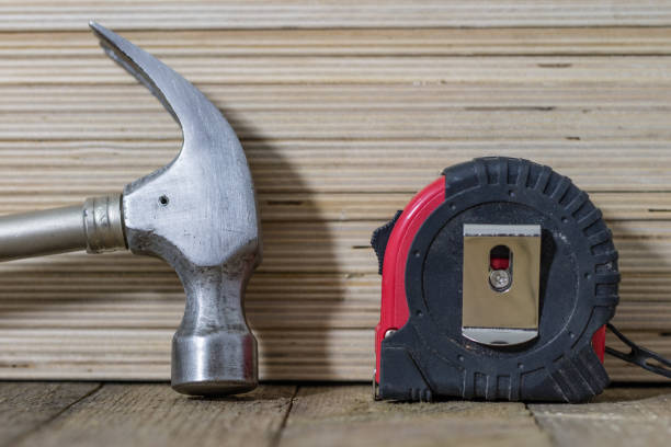 Desk of a craftsman tools on a wooden background. top view, flat lay concept.