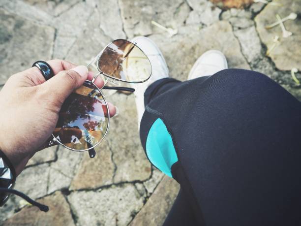 istock Selfie of Sun glasses on hand 911526250