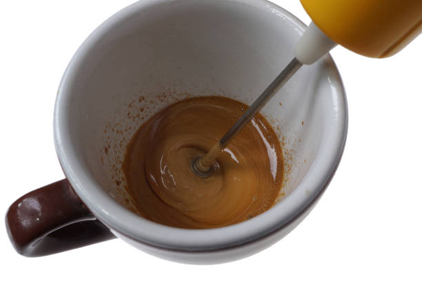 istock Electric beater for instant coffee and cup isolated on white 911526660