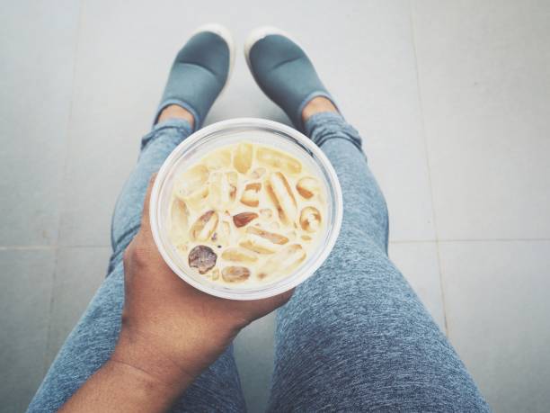 istock Selfie of shoes with coffee cup on hand 911526820
