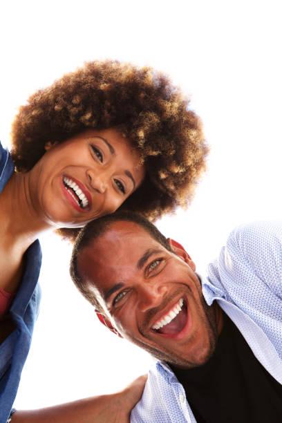 istock Close up happy fun couple laughing together on white background 911536206