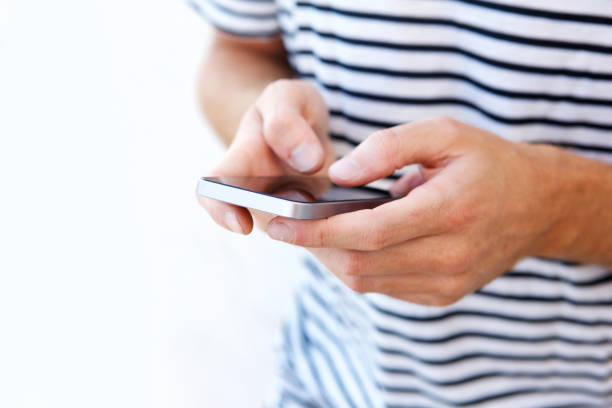 istock male hands holding mobile phone 911538072