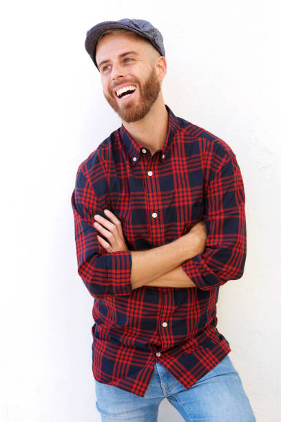 istock handsome young man with hart laughing against white background 911538080