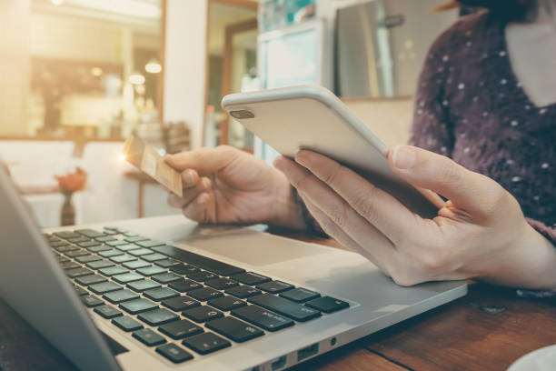 istock Online payment,Woman's hands holding smartphone and using credit 911555996