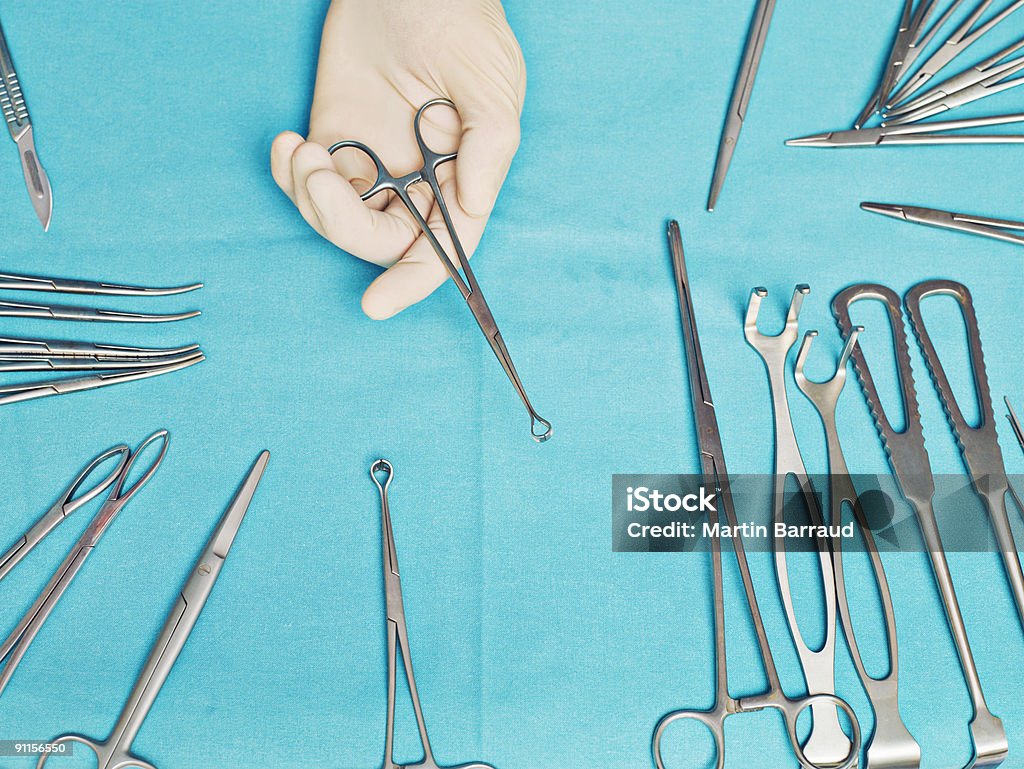 Doctor holding clamp  Surgery Stock Photo