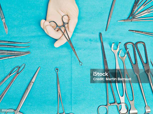 Doctor Holding Clamp Stock Photo - Download Image Now - Surgery, Surgeon, Scalpel