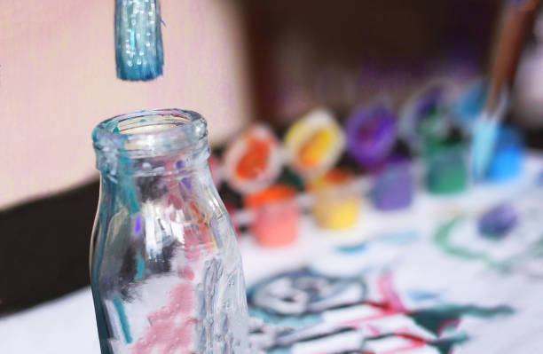 istock Glass jar and kid's paints 911567714