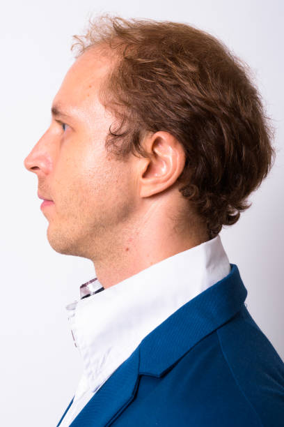 istock Profile View Of Man Face In 30s Against White Background 911570256