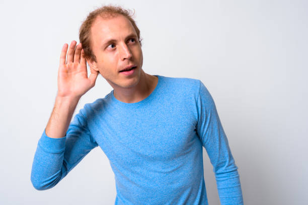 istock Portrait Of Man Against White Background 911573280